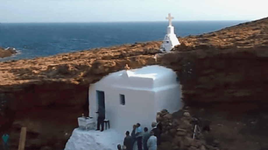 Front of the church of the Panagia (Our Lady) at Mykonos, Tragonisi, Greece that commemorate festival of her birth with rocks in the background