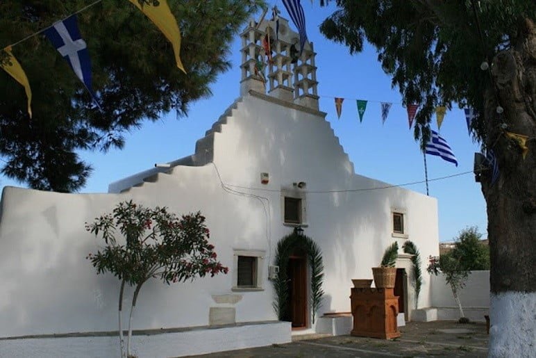 front of the church Pera Panagia commemorate festival of them at Paros, Marmara, Greece surrounded by trees 