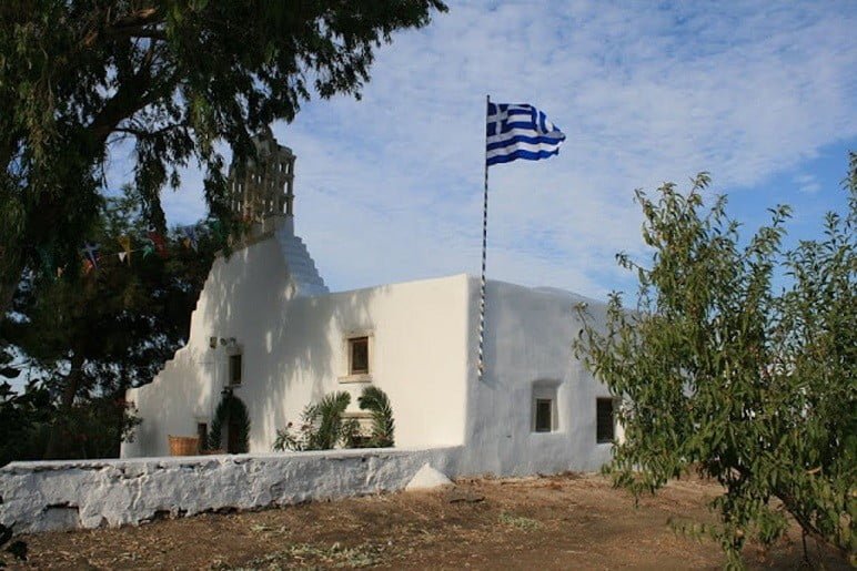 front of the church Pera Panagia commemorate festival of them at Paros, Marmara, Greece surrounded by trees 