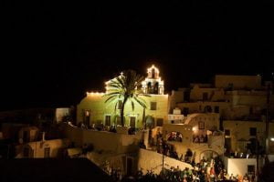 church St. Matrona of Foinikia at Santorini by night with peoples on 