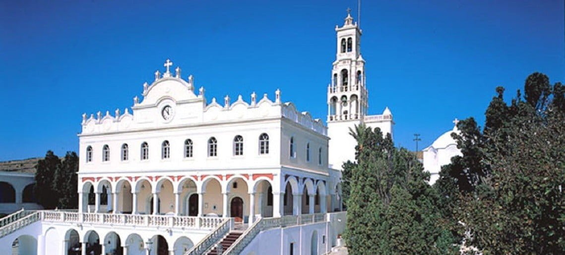 front the church of the Discovery of the Holy icon of Virgin Mary with stairs covered with red carpet at Tinos, Greece and commemorate festival of her birth