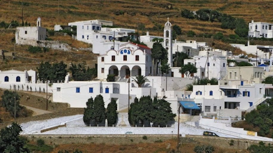 church of the Holy Apostles at Tinos, Triandaros, Greece that commemorate festival of her birth with houses in the background