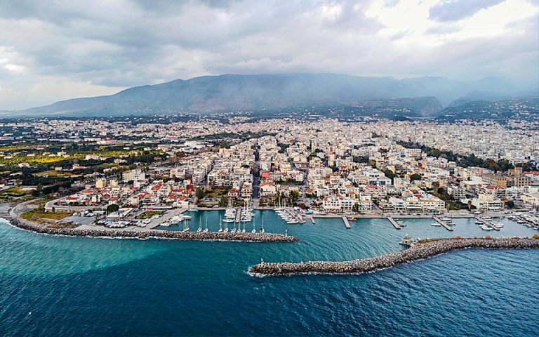 view of Kalamata marina with the boths on the port and many buildings