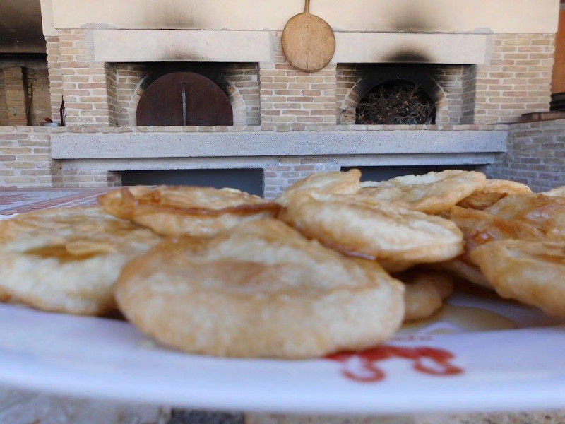 Wood ovens and warm breads on a plate