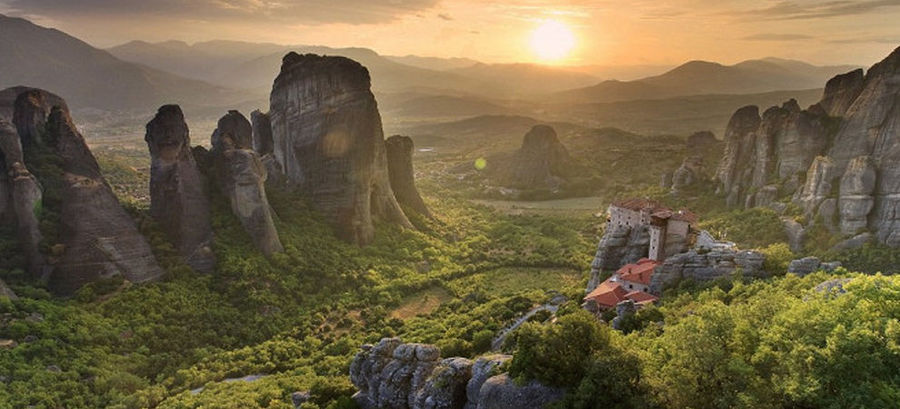 far view of the 'Tsililis' building located on the rock in a landscape with high rocks in the sunshine day