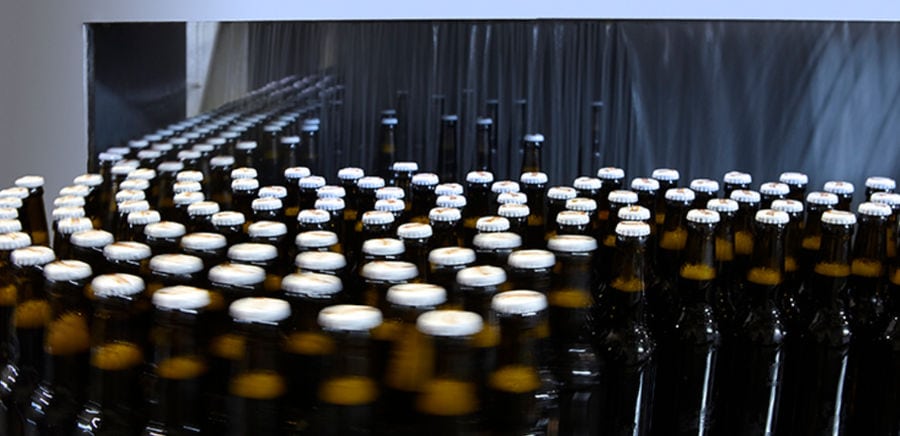 stacked bottles on conveyor belt at 'Vergina Beer' plant