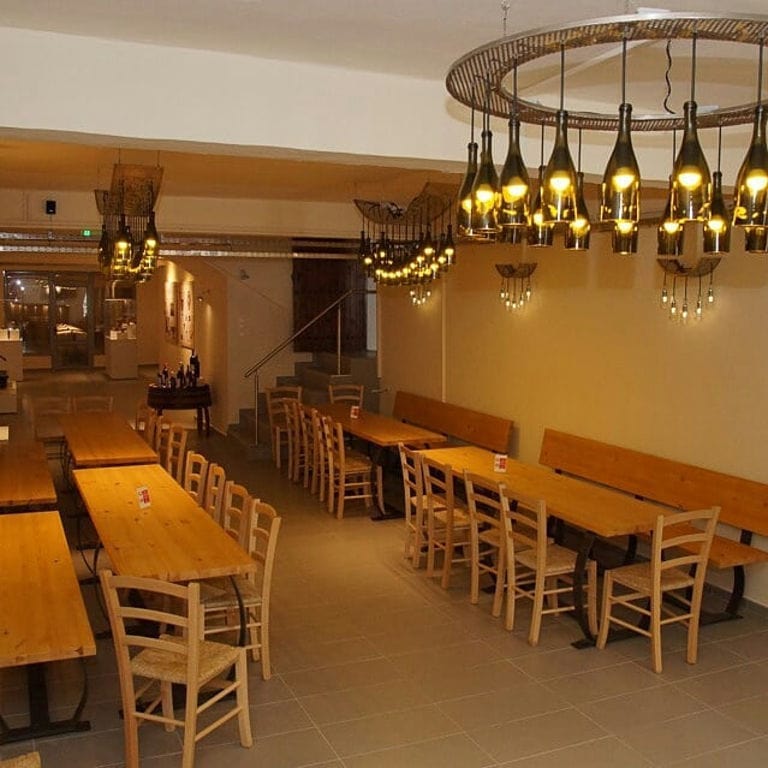 'Zoinos Winery' tasting room with chandelier with wine bottles