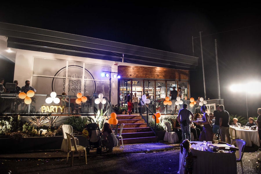 tourists front the 'Dardouma Family' store by night