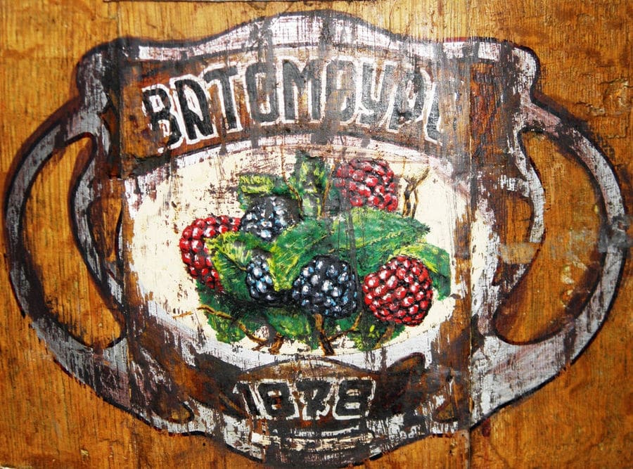 part of old personalized wooden barrel sign with the 'Gatsios Distillery' logo