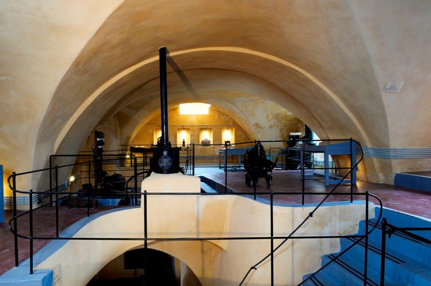 stairs leading to a room with arches at 'Venetsanos Wine Museum'