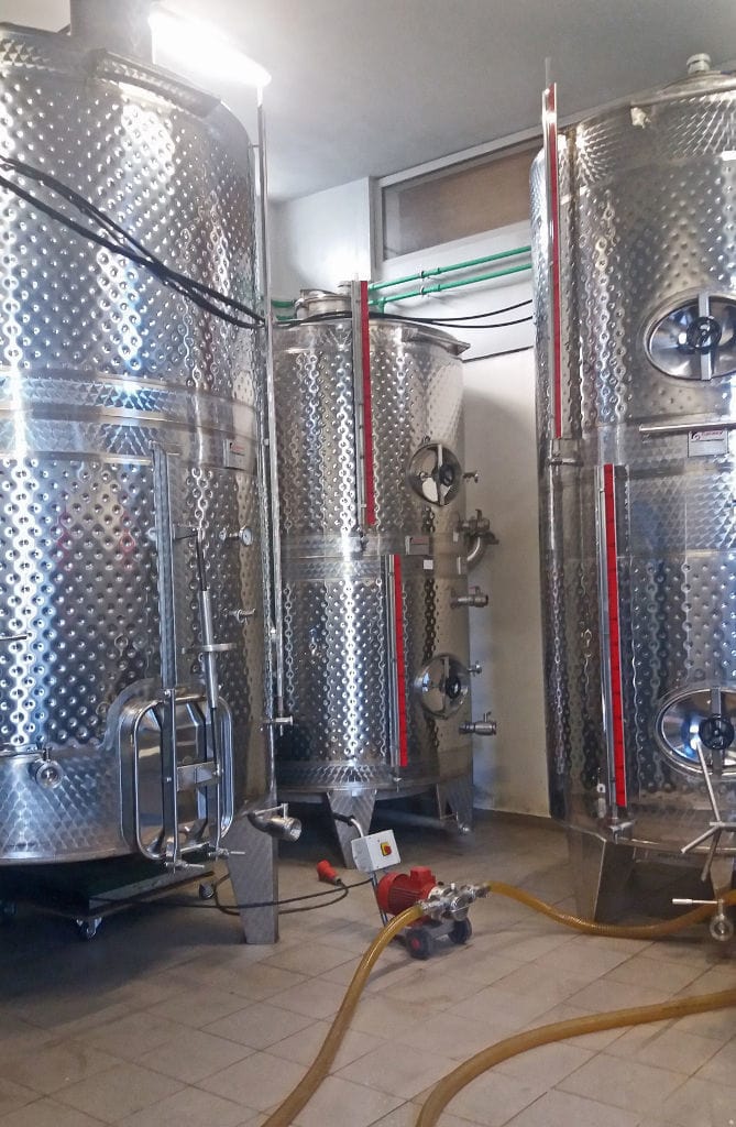 aluminum wine storage tanks at 'Kourkoulou Winery' plant