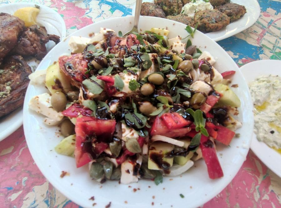 A vibrant plate showcases a colorful salad, adorned with an assortment of fresh, crisp vegetables. Nature's palette blends harmoniously, inviting a healthy and delightful feast for the senses.