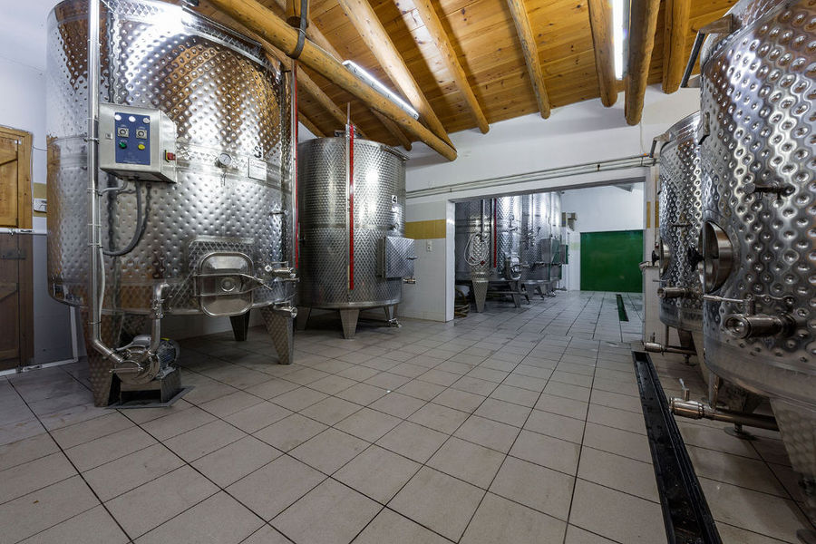lying aluminum wine storage tanks at Vakakis Winery plant