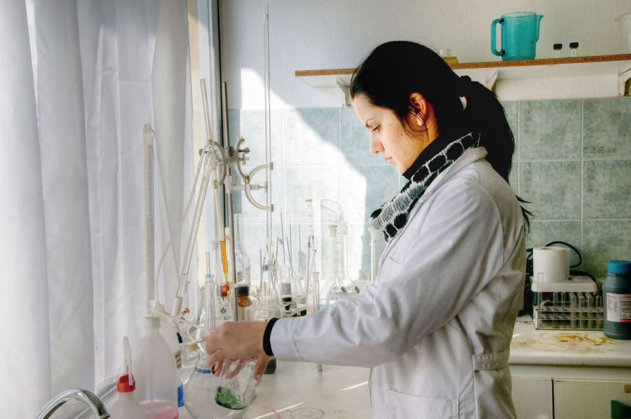young woman oenologist making wine analyses in 'Vaeni Naoussa' laboratory
