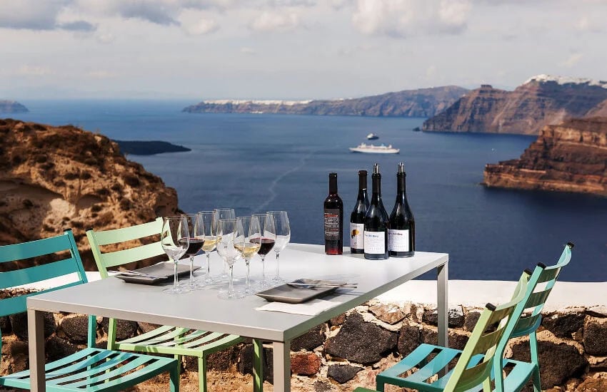 A perfectly set table amidst stunning views. Savor the flavors, indulge in beauty, and toast to unforgettable moments