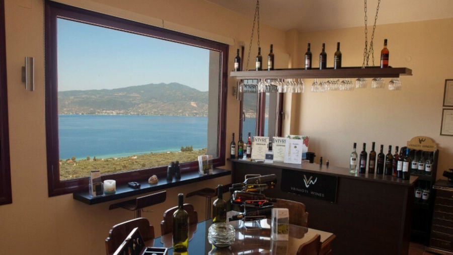 a corner of Vriniotis Winery wine tasting room with wood table