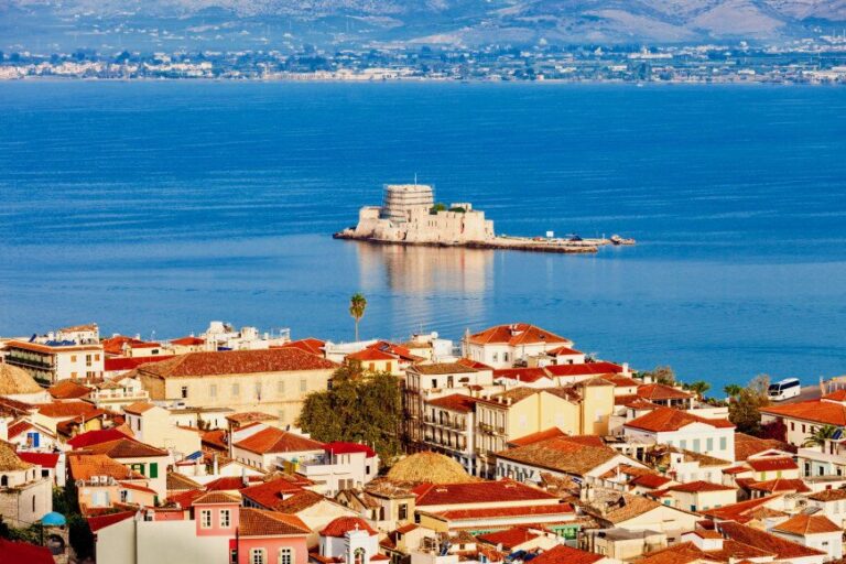 Greece with houses and a far in the sea in the background