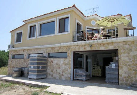 one side of the building with stone walls of' Vriniotis Winery