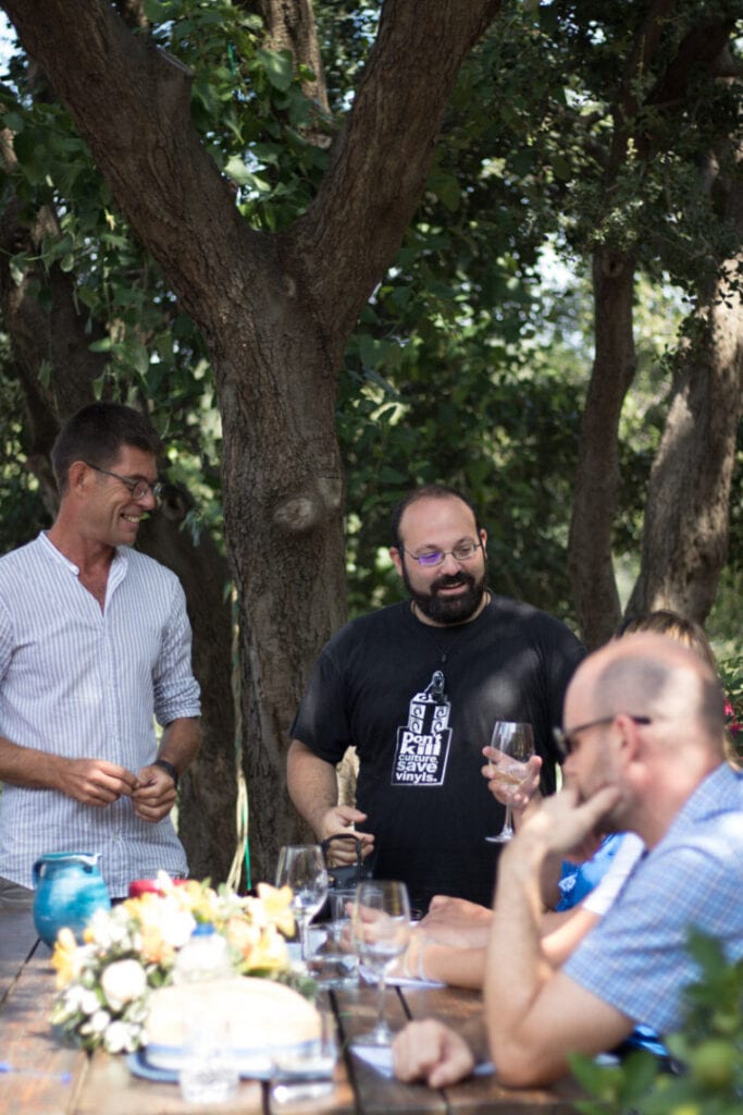 Three men revel in a wine tasting session, their faces animated with delight as they savor the nuanced flavors. The camaraderie and joy reflect the shared passion for exquisite wines and the art of appreciation.