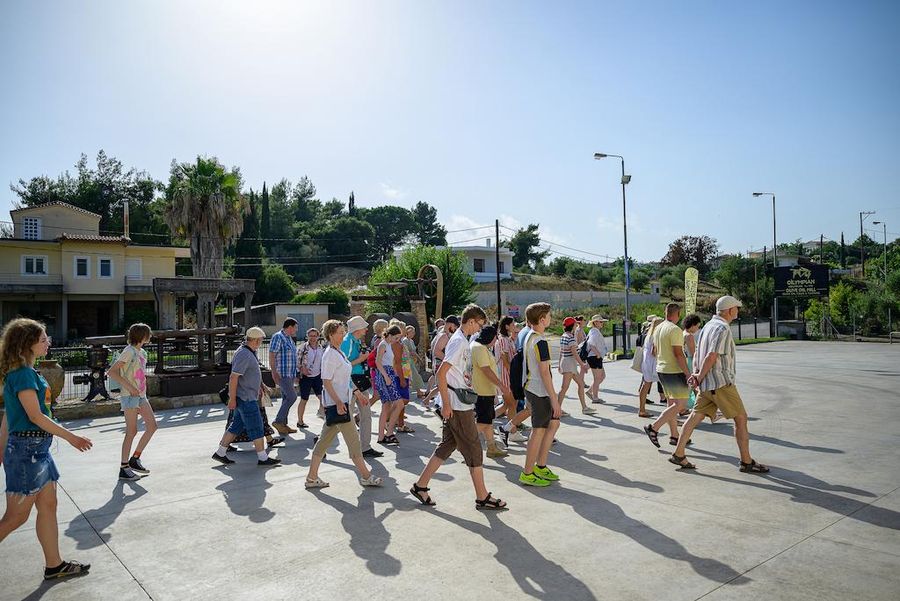 A group of tourists walking at Oilympian Koufolias
