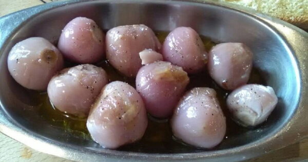 Close-up of bowl with marinated Greek askordοulakas mens bulbs of the plant scientifically known as “Muscari comosum”