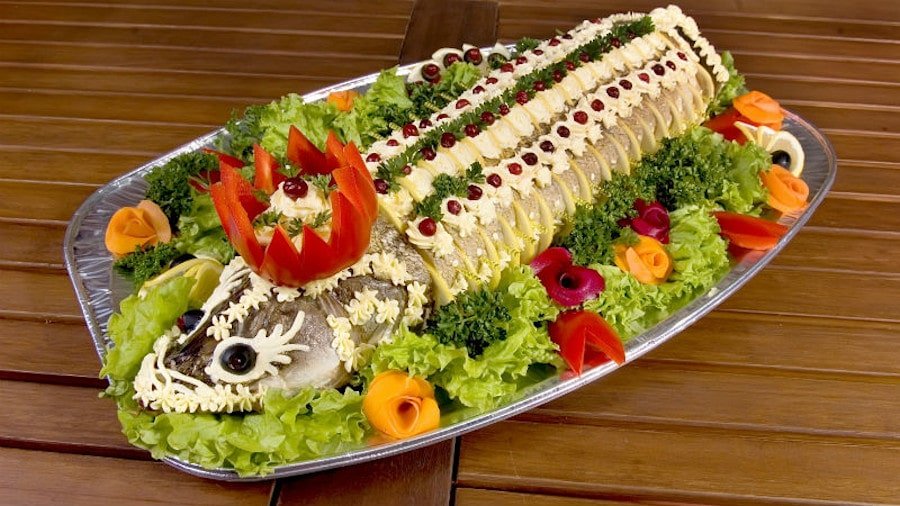 Plate with Greek ‘Athenian salad fish mayonnaise’ with boiled fish