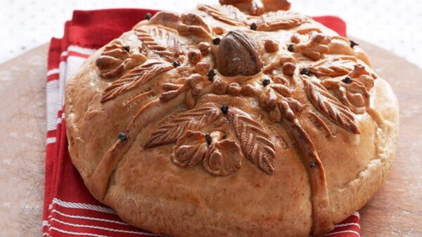 Close-up of Greek ’Christopsomo’ means engraved personalized round bread with a nut on top