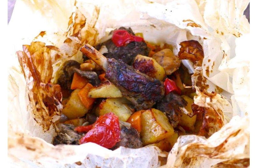 Close-up of Greek ‘Exochiko’ means lamb wrapped in oiled paper with garlic