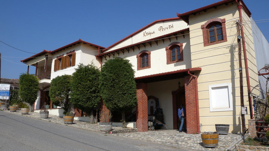 on side of 'Foundi Estate' with pavement and trees in the front