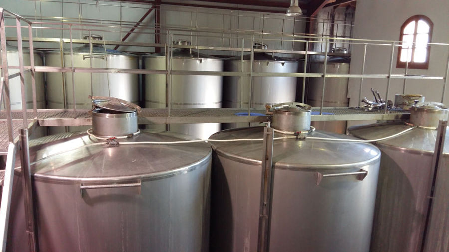 view of the top of aluminum wine storage tanks at 'Foundi Estate' plant