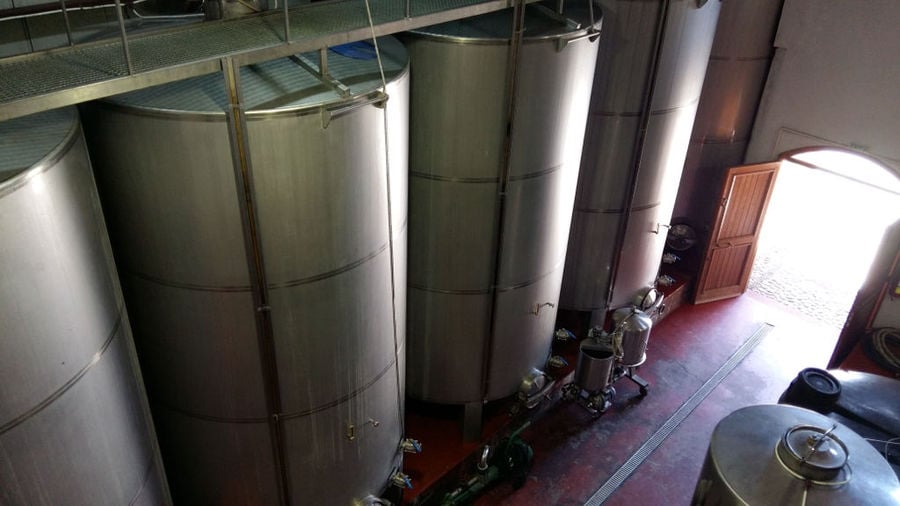 view from above of aluminum wine storage tanks at 'Foundi Estate' plant