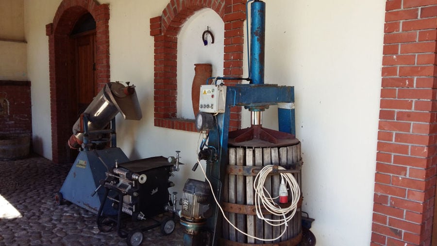 old manual press grapes is by the wall of 'Foundi Estate'