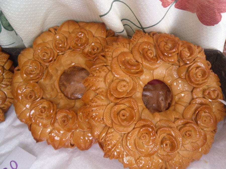 Close-up of two Greek ‘Gamokouloura’ means decorative rolls bread