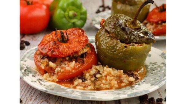 Close-up of plate with ‘Gemista’ a pepper and a tomato stuffed with rice and baked in the oven