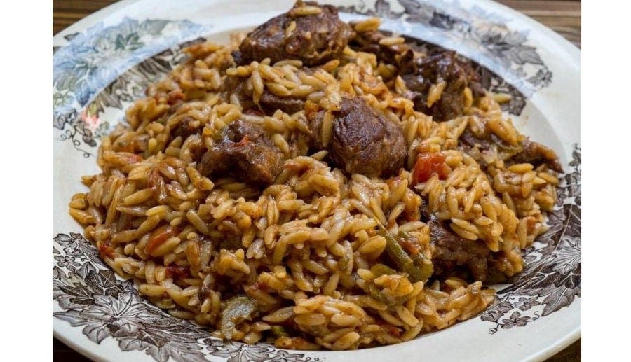 Close-up of Greek ‘Giouivetsi’ means pieces of lamb and orzo pasta with a sauce of tomatoes cooked in clay pot