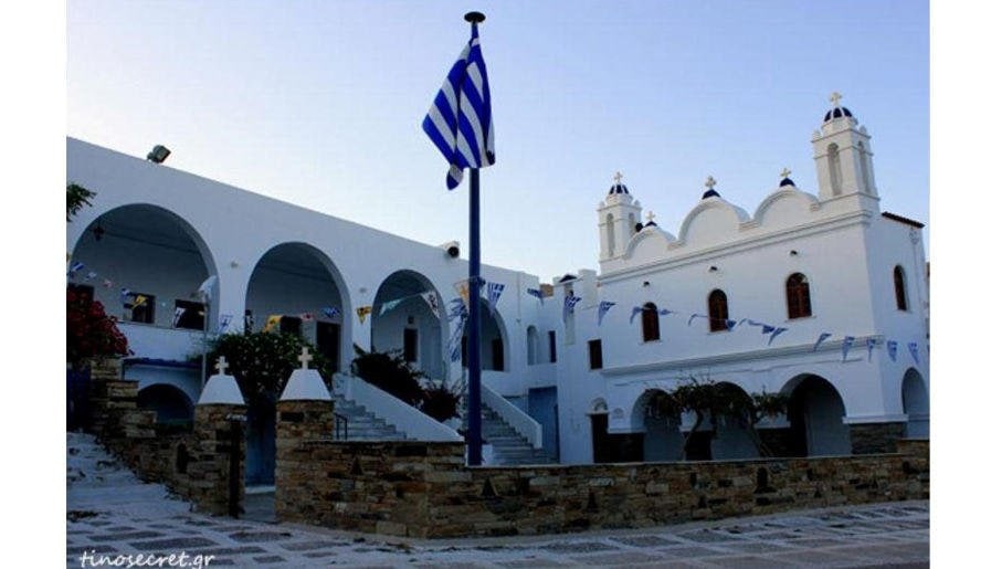 Hora with a Greek flag outside