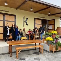 Kappa Winery's yard with flowers, tables and stools where the visitors enjoy their wine