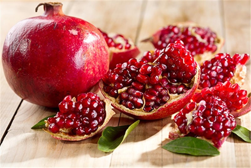 ripe and pieces of pomegranate with pips from 'Ktima Cheimonidi' crops