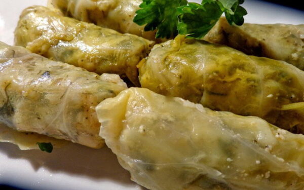 Close-up of Greek ‘Lahanodolmades’ means stuffed cabbage leaves with rice and cooked with white sauce