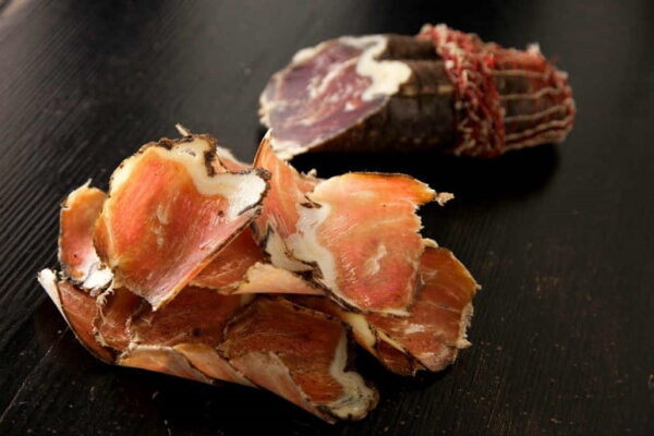 Close-up of slices of Greek ‘louza’ as like prosciutto