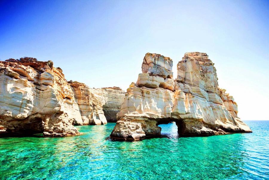 boat shelters carved directly into the rock at Milos island