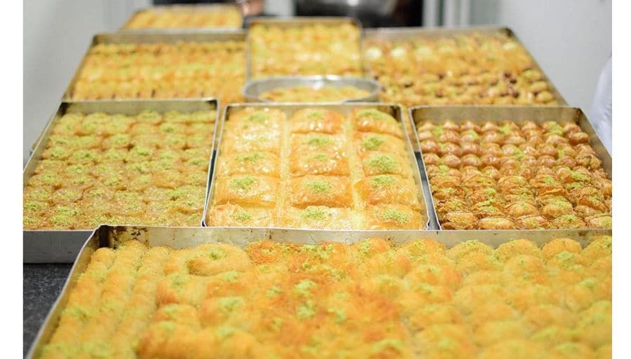 Baking pans with ‘siropiasta’ are to sweets made with thin leaves of pastry and dried nuts over which