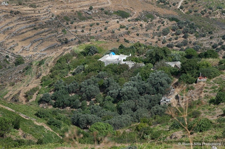 Greece surrounded by trees and hills