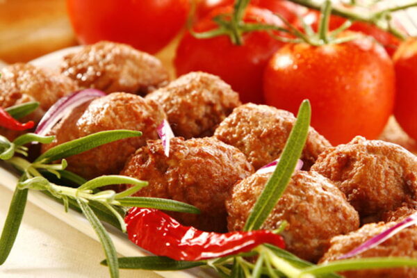 Greek ‘pitaroudia’ are chickpea meatballs fried or even oven-baked and fresh tomatoes in the background