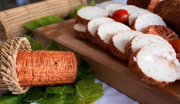 Close-up of round pieces of Greek ‘Krasotiro’ a white cheese covered with brown