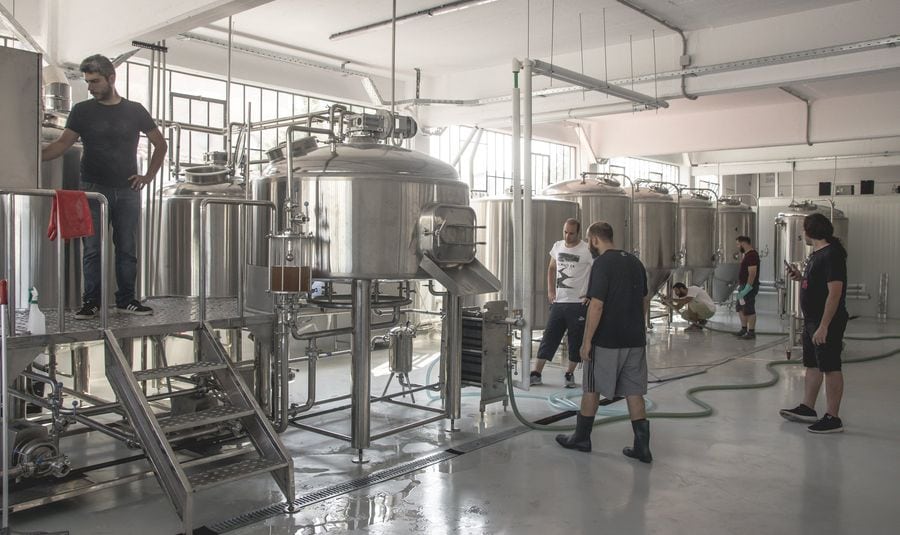 Employees check the machines and the production process