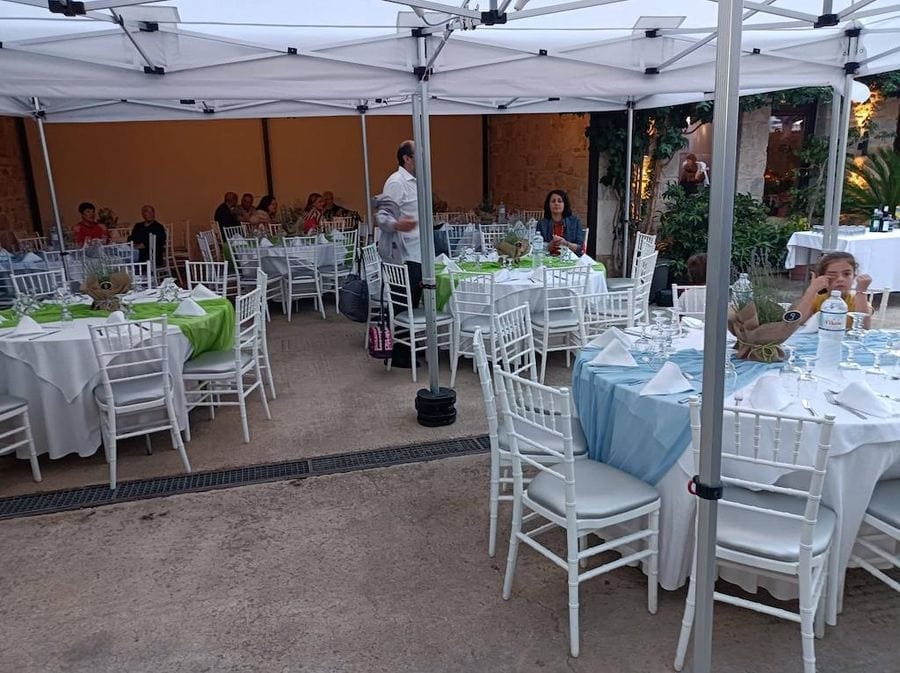 Restaurant at Gikas winery outside with tables and white tablecloths and the area covered with tents