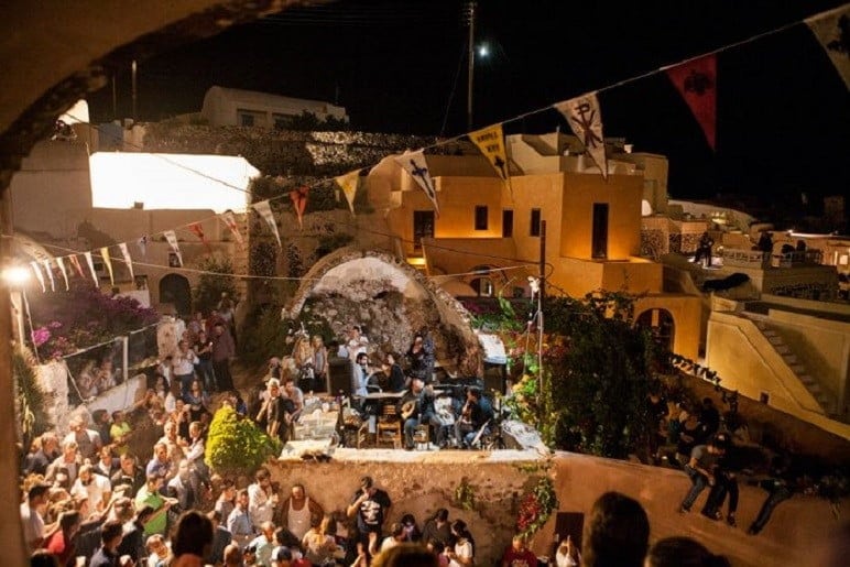 church St. Matrona of Foinikia at Santorini by night with peoples on