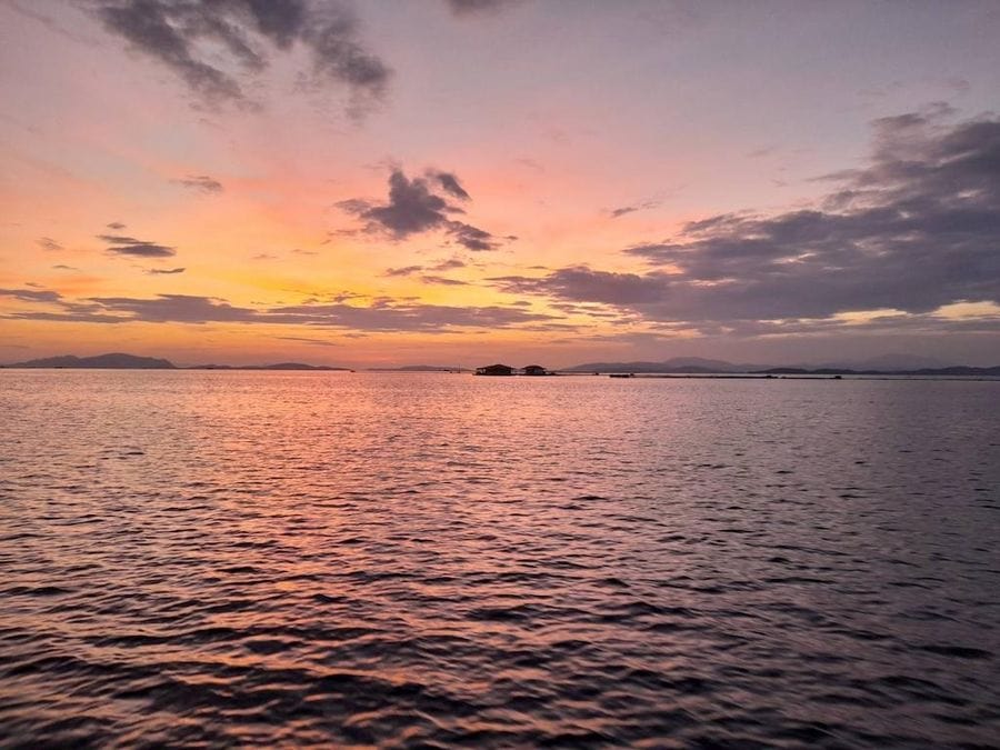 Sunset on the sea with the Stefanos Kaneletis’ boat on the horizon