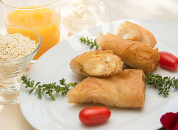 Close-up of plate with small ‘teroptaria’ from filo filled with sweet trahana